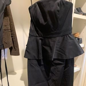 Black strapless peplum cocktail dress